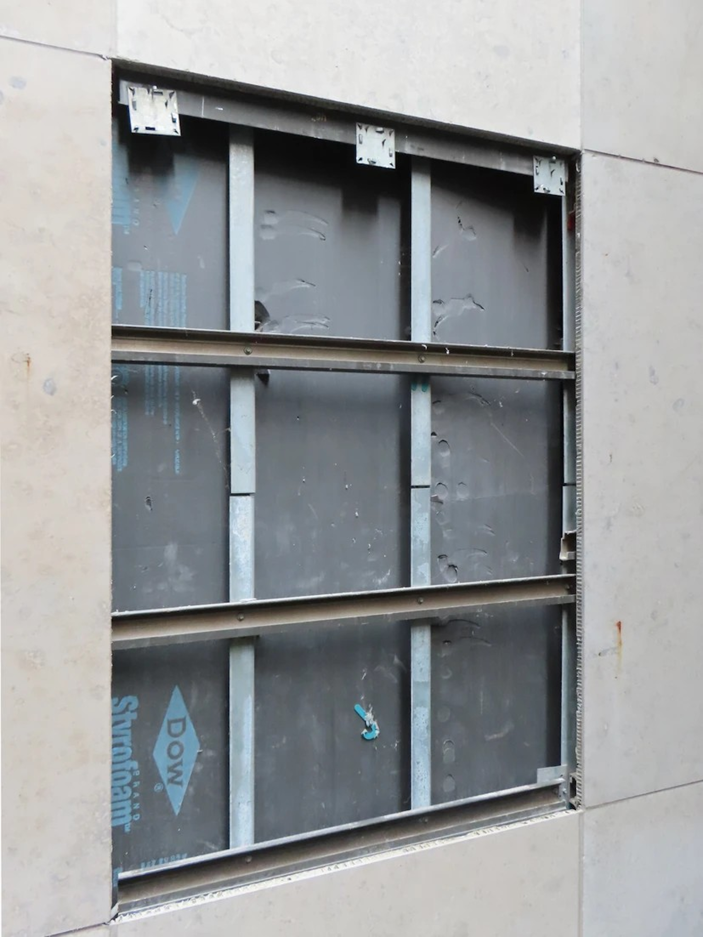 Example of framing that connects stone panels to the building structure.